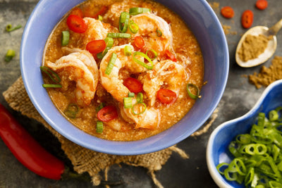 Kare kare frutti di mare con salsa di arachidi e cocco
